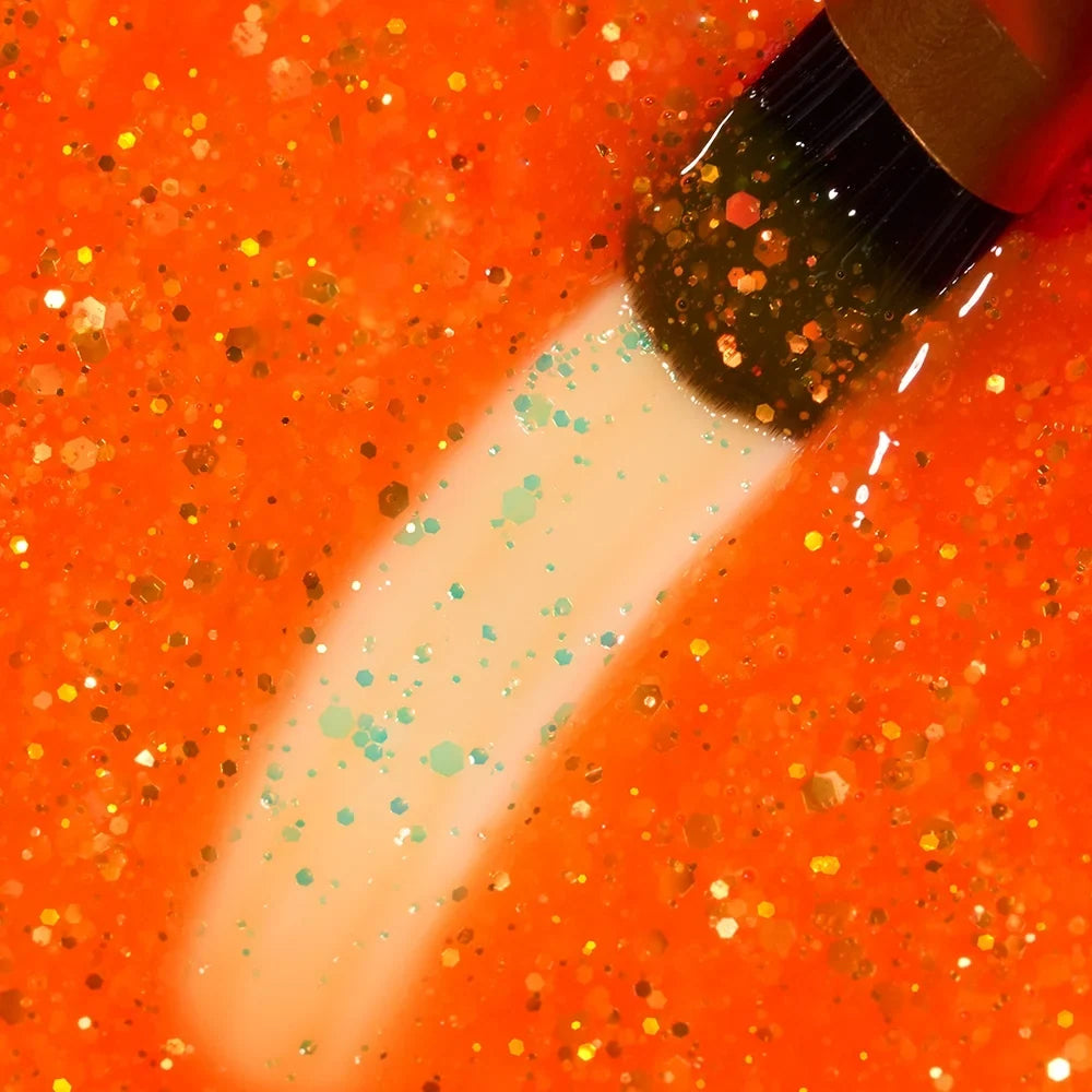 Detalle del color naranja neón con purpurina del Builder Gel Cupio Glitter Neon Morning Mimosa